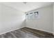 This bedroom features new gray floors and a large window at 5368 Stafford Nw Dr, Lilburn, GA 30047