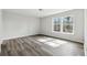 Spacious bedroom with large windows, new floors, and ample natural light at 5368 Stafford Nw Dr, Lilburn, GA 30047