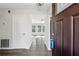 Inviting entryway showcasing open floor plan with new flooring and lots of light at 5368 Stafford Nw Dr, Lilburn, GA 30047