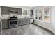 Modern kitchen with stainless steel appliances, subway tile backsplash, and granite countertops at 5368 Stafford Nw Dr, Lilburn, GA 30047