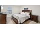 Comfortable guest bedroom with classic furnishings and a serene atmosphere at 938 Blue Juniper Cir, Loganville, GA 30052