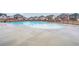 A community pool surrounded by well-maintained grounds and other residences in the neighborhood at 938 Blue Juniper Cir, Loganville, GA 30052