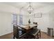 Cozy dining area featuring a wooden table with bench seating and a door leading to the backyard at 938 Blue Juniper Cir, Loganville, GA 30052