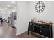 Welcoming entryway featuring a modern bar cabinet with contrasting dark wood floors at 938 Blue Juniper Cir, Loganville, GA 30052