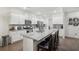 Modern kitchen with white cabinets, stainless steel appliances, and granite countertops at 938 Blue Juniper Cir, Loganville, GA 30052