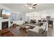 Bright living room with fireplace and large sectional sofa, next to modern kitchen at 938 Blue Juniper Cir, Loganville, GA 30052