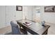 Office space featuring a large wooden desk and artwork at 938 Blue Juniper Cir, Loganville, GA 30052