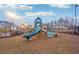 Community playground features a slide and climbing structures, offering outdoor fun for residents at 938 Blue Juniper Cir, Loganville, GA 30052