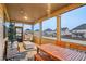 Inviting screened porch with wooden table and chairs, perfect for outdoor dining at 938 Blue Juniper Cir, Loganville, GA 30052
