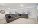 Bright recreation room includes a plush sectional sofa with a billiards table and a mounted television at 938 Blue Juniper Cir, Loganville, GA 30052