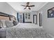 Comfortable bedroom with a king-size bed, hardwood floors, and city view at 199 14Th Ne St # 2010, Atlanta, GA 30309