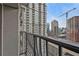 View from a balcony overlooking the city skyline, showcasing new construction and nearby buildings at 199 14Th Ne St # 2010, Atlanta, GA 30309