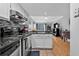 This kitchen features stainless steel appliances, a breakfast bar, and tile floors at 199 14Th Ne St # 2010, Atlanta, GA 30309