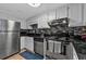 This kitchen features stainless steel appliances, white cabinets, and a sleek backsplash at 199 14Th Ne St # 2010, Atlanta, GA 30309