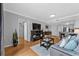 Cozy living room with hardwood floors, gray sofa, and modern decor at 199 14Th Ne St # 2010, Atlanta, GA 30309