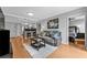 This is a living room with hardwood floors and a view of the kitchen and bedroom at 199 14Th Ne St # 2010, Atlanta, GA 30309