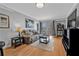 This living room features comfortable seating and balcony access with city views at 199 14Th Ne St # 2010, Atlanta, GA 30309