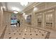 Building lobby with marble flooring, pendant lighting, and classic architectural details at 199 14Th Ne St # 2010, Atlanta, GA 30309