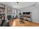 Comfortable home office with natural light, hardwood floors, and built-in bookshelves at 199 14Th Ne St # 2010, Atlanta, GA 30309