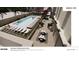 From a birds eye view, this image shows the pool with lounge seating and a nearby club break-out area at 199 14Th Ne St # 2010, Atlanta, GA 30309