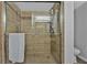 Elegant walk-in shower featuring ceramic tile surround, glass doors, and chrome shower head at 199 14Th Ne St # 2010, Atlanta, GA 30309