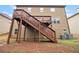 Spacious backyard with stairs leading to upper-level deck at 2656 Muskeg Sw Ct, Atlanta, GA 30331