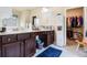 Bathroom featuring double sink vanity, marble counters, and walk-in closet at 2656 Muskeg Sw Ct, Atlanta, GA 30331