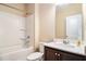 Bathroom featuring a vanity with white countertop, toilet, and shower with tub at 2656 Muskeg Sw Ct, Atlanta, GA 30331