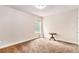 Cozy bedroom with a neutral color palette, carpet, and a window overlooking the backyard at 2656 Muskeg Sw Ct, Atlanta, GA 30331