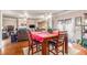 A dining room area with wood table and chairs that leads to the kitchen and living room areas at 2656 Muskeg Sw Ct, Atlanta, GA 30331