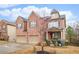 Charming brick home with a two-car garage and a well-maintained lawn on a sunny day at 2656 Muskeg Sw Ct, Atlanta, GA 30331