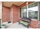 Welcoming front porch featuring a comfortable bench and shaded seating area at 2656 Muskeg Sw Ct, Atlanta, GA 30331
