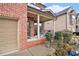 Cozy front porch with brick columns and space for outdoor seating at 2656 Muskeg Sw Ct, Atlanta, GA 30331