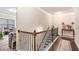 Bright hallway features hardwood floors, iron railing staircase, and elegant decor at 2656 Muskeg Sw Ct, Atlanta, GA 30331