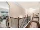 Bright hallway features hardwood floors, iron railing staircase, and elegant decor at 2656 Muskeg Sw Ct, Atlanta, GA 30331