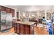A kitchen with a center island and granite countertop that opens to the dining and living room areas at 2656 Muskeg Sw Ct, Atlanta, GA 30331
