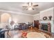 A living room with a fireplace, hardwood floors, and a decorative rug at 2656 Muskeg Sw Ct, Atlanta, GA 30331