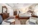 Spacious main bedroom with tray ceiling, dark wood furnishings, and neutral tones at 2656 Muskeg Sw Ct, Atlanta, GA 30331