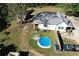 Aerial view of a lovely home with a pool, a shed and large backyard at 4267 Klondike Rd, Lithonia, GA 30038