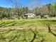 Large backyard with buildings and recreational areas throughout the property at 4267 Klondike Rd, Lithonia, GA 30038