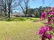 Backyard showcasing lush azaleas in the foreground at 4267 Klondike Rd, Lithonia, GA 30038