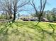 Well-maintained backyard featuring established trees providing ample shade at 4267 Klondike Rd, Lithonia, GA 30038