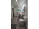 Bright bathroom with a double vanity, marble shower and grey tile floors at 4267 Klondike Rd, Lithonia, GA 30038