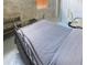 Bedroom with a gray quilt bed, desk, and a comfy office chair at 4267 Klondike Rd, Lithonia, GA 30038