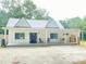 Charming home with a covered porch and metal roof at 4267 Klondike Rd, Lithonia, GA 30038