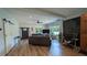 Spacious living room features hardwood floors, a ceiling fan and neutral colors at 4267 Klondike Rd, Lithonia, GA 30038