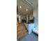 Hallway stairway featuring hardwood steps and a modern railing at 4267 Klondike Rd, Lithonia, GA 30038