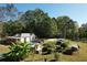 Acreage featuring a pool, mature trees, and outbuildings at 4267 Klondike Rd, Lithonia, GA 30038