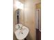 Up close look at half bathroom showing vanity, mirror, light fixture, and doorway at 1211 Grampian Pass # 15, Marietta, GA 30008