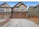 Townhome with brick and siding, featuring a two-car garage and a concrete driveway at 1211 Grampian Pass # 15, Marietta, GA 30008
